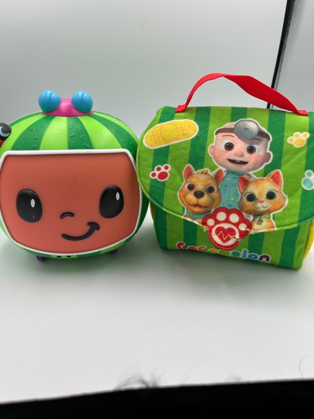 Cocomelon soft carry bag and music roll around toy with wheels